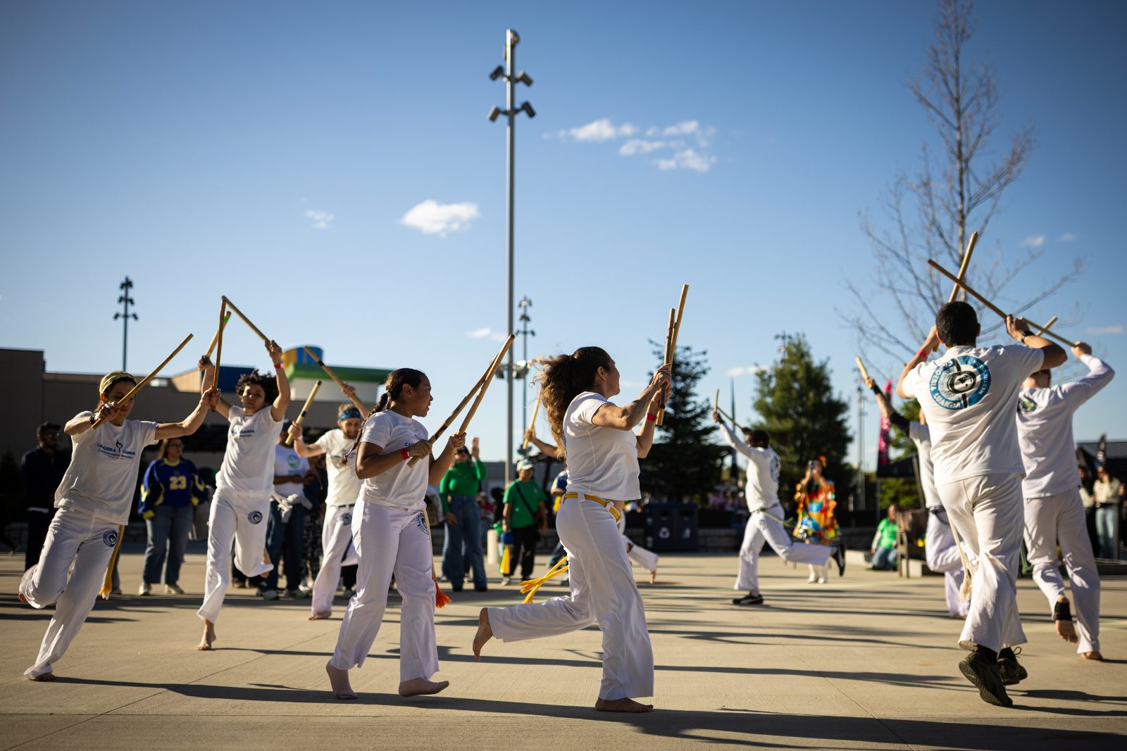 Capoeira roda with berimbaus raised at Agora